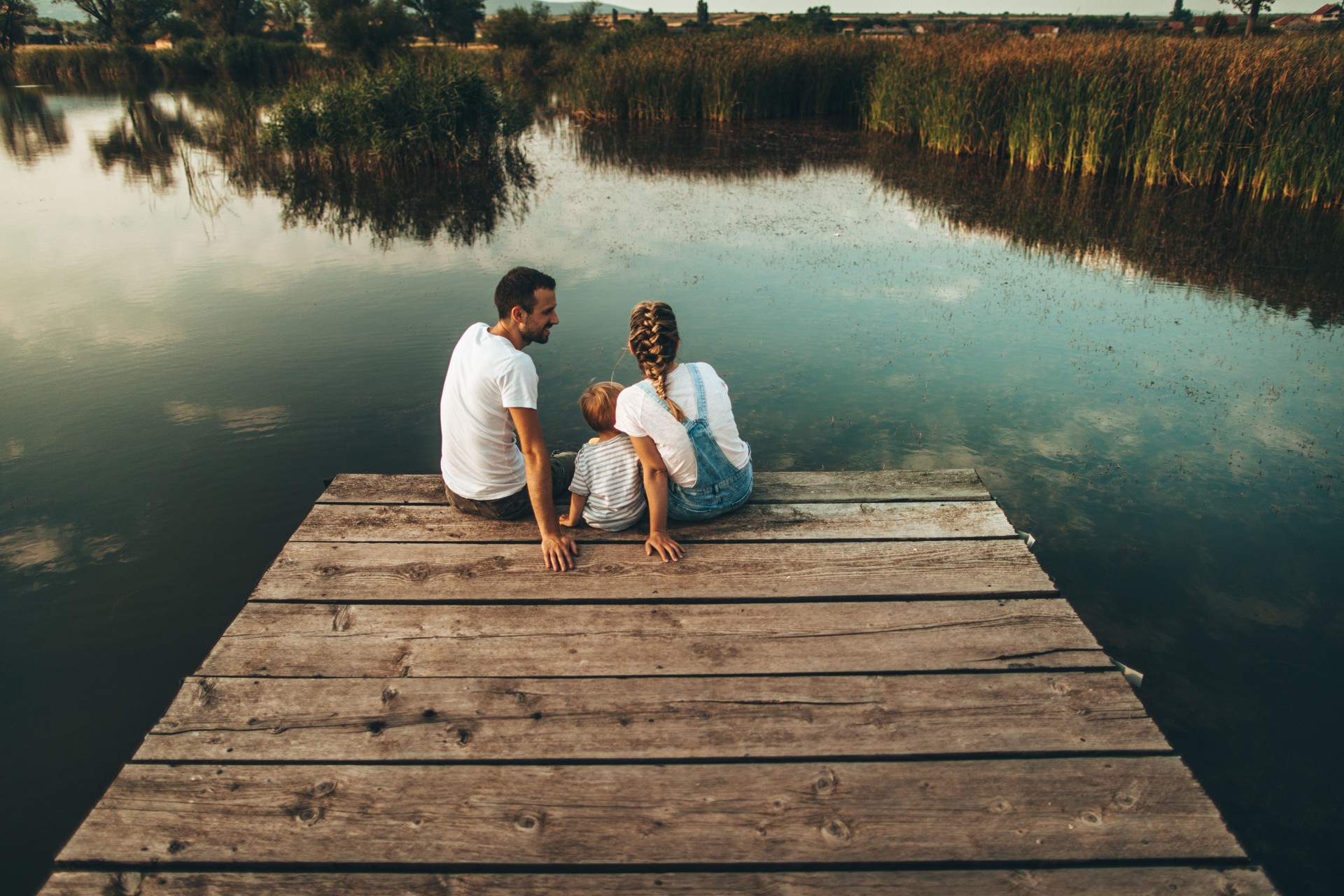 Loving family by the lake
